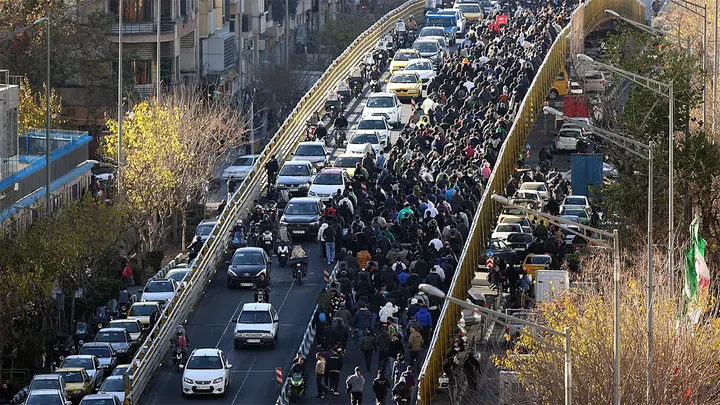 Protesters march in downtown Tehran